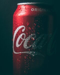 A sleek photo of a Coca-Cola can representing the Coca-Cola brand